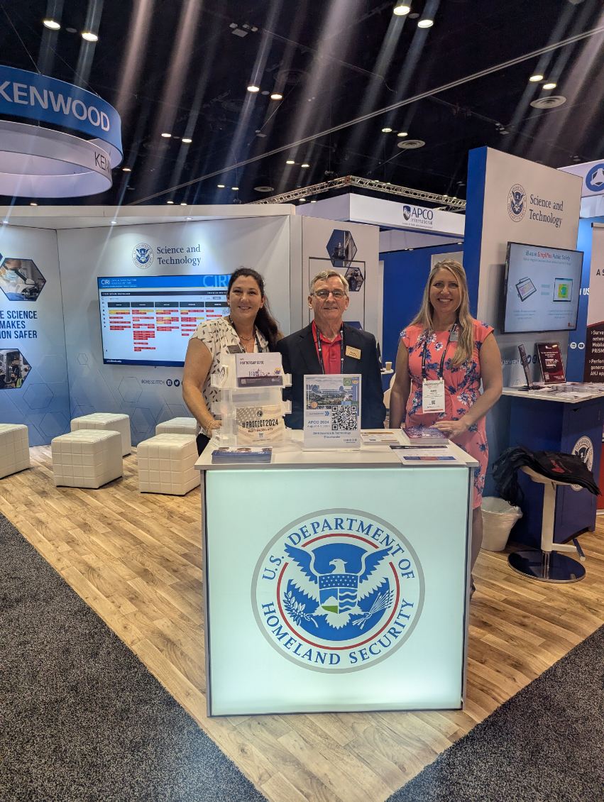 CIRI program manager Jennifer Summers, executive director Randy Sandone and program manager Jamie Frye stand at APCO booth